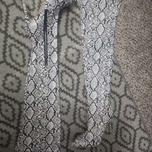 Over the knee, stiletto heel pointed toe boots